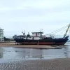 Ship Aground Waiting for the Tide