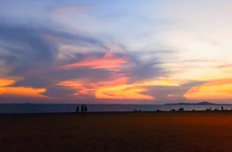 sunset sky painted with orange and pink hues over Najomtien Beach